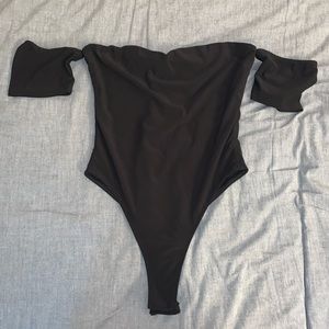 Black “off the shoulder” body suit.
